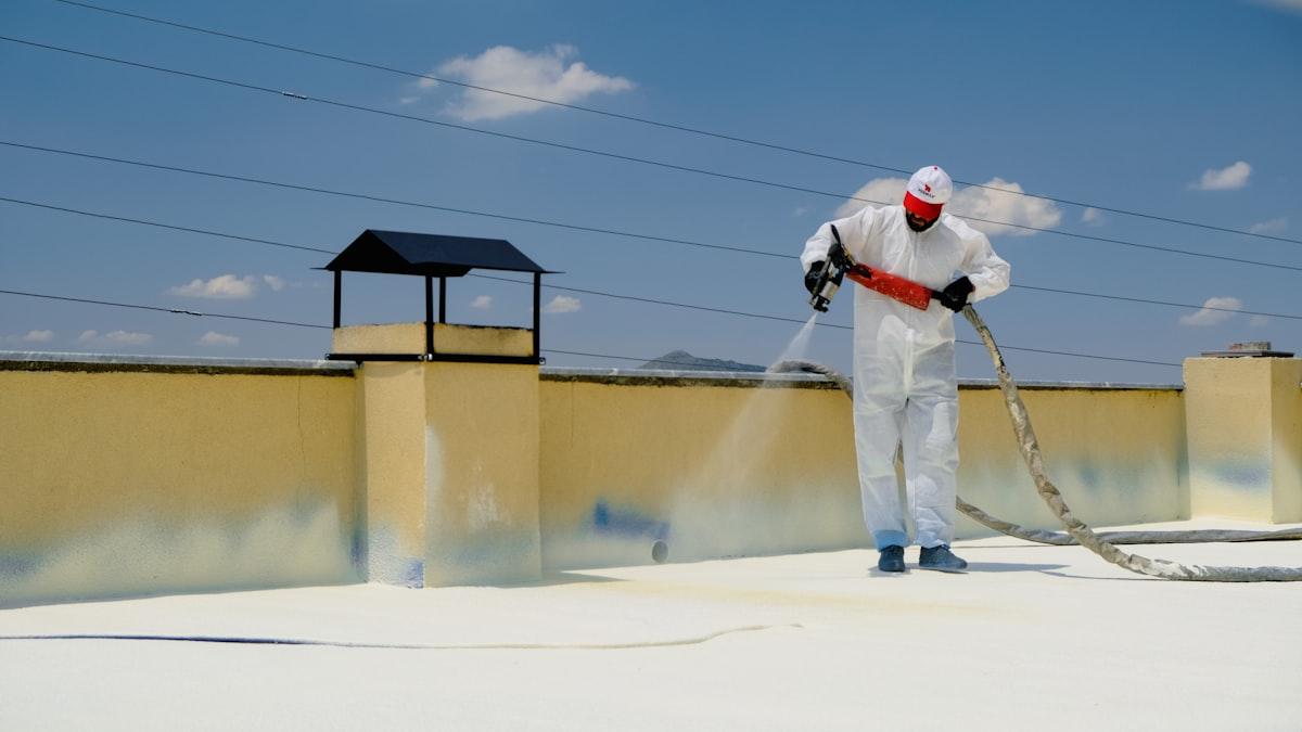 Waterproofing membrane being applied to a flat roof