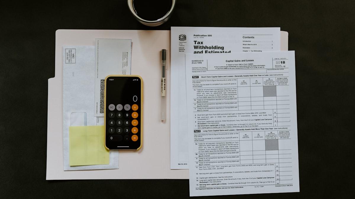 Working through a contractor cost breakdown and fee percentage on paper