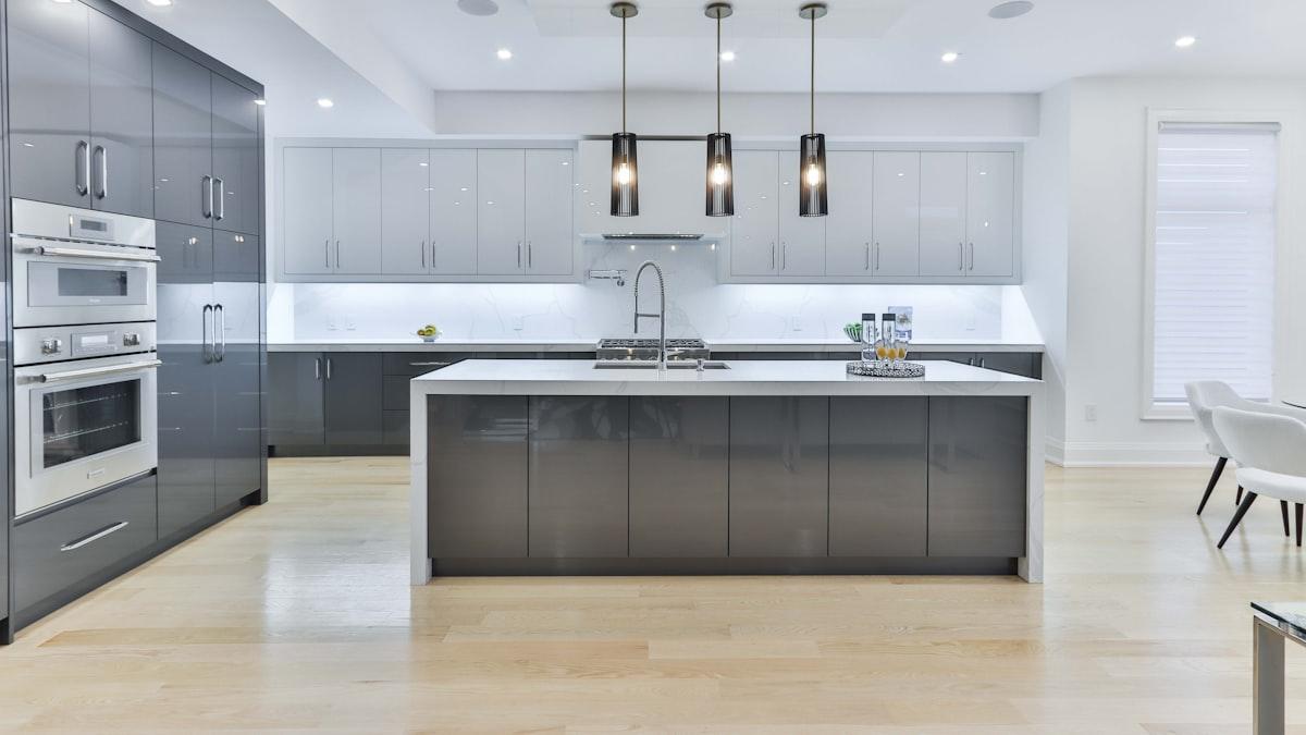 Renovated modern kitchen with fitted cabinetry and worktop