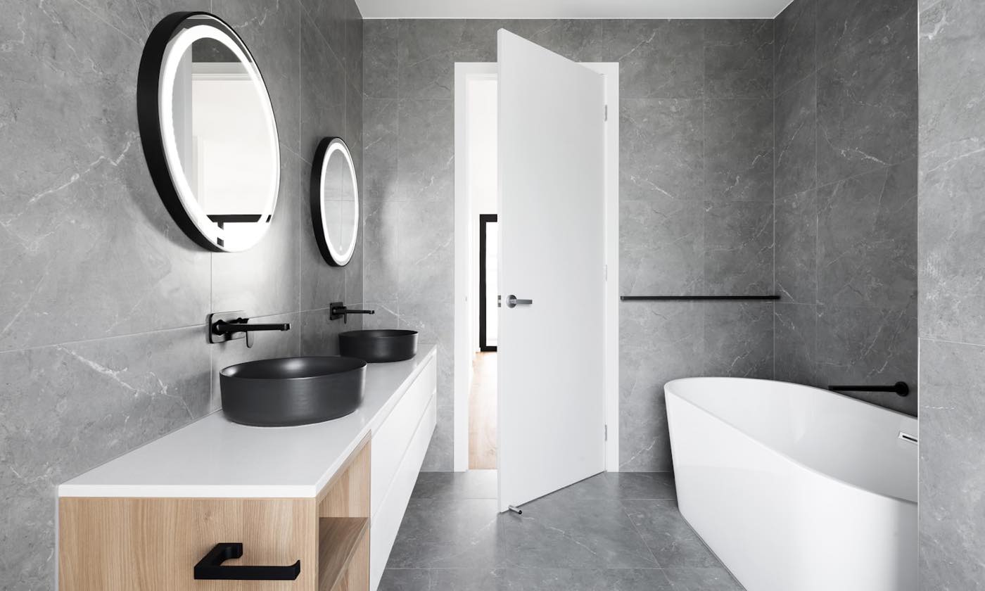 Luxury apartment renovation interior in Clifton Karachi by Naffees & Sons — marine-grade joinery, imported stone, and concealed lighting in a seafront block