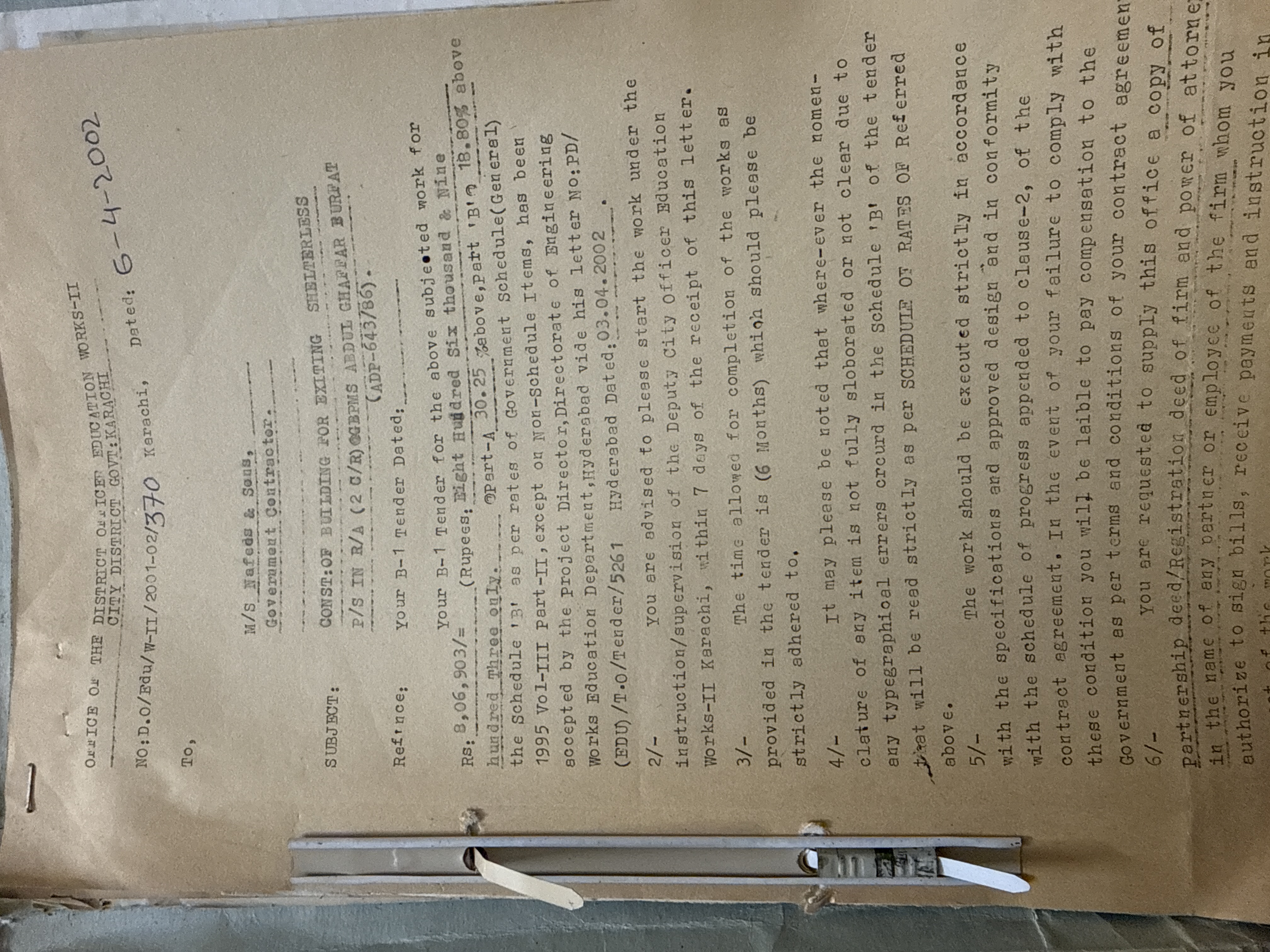 Government tender acceptance and work order for shelterless school construction at GPS Abdul Ghaffar, Gadap Town, Karachi — Naffees & Sons, 2002