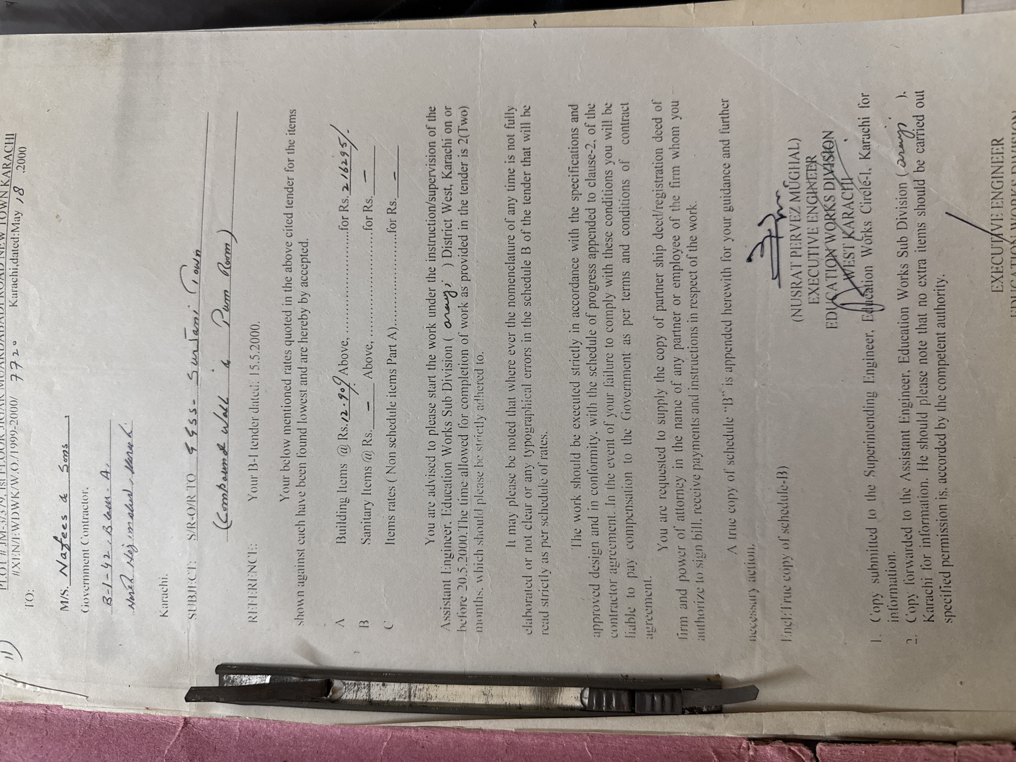 Work order for compound wall and pump room construction at Govt Girls Secondary School No 14 Sirjani Town Karachi — signed by Executive Engineer Nusrat Pervez Mughal Education Works Division West Karachi 2000